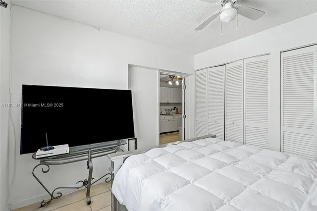 a bathroom with a shower sink and mirror