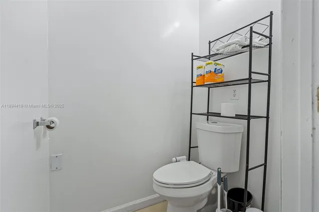 a bedroom with a bed and a flat tv screen