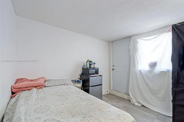 a bathroom with a toilet sink vanity and mirror