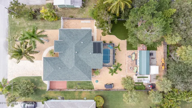 an aerial view of a house with outdoor space