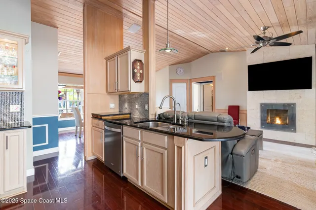 a kitchen with stainless steel appliances granite countertop a stove and a sink