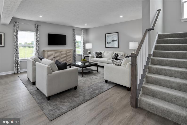 3422 Fox Pointe Lane York, PA 17404 - Photo 4 of 27 a living room with furniture and a flat screen tv