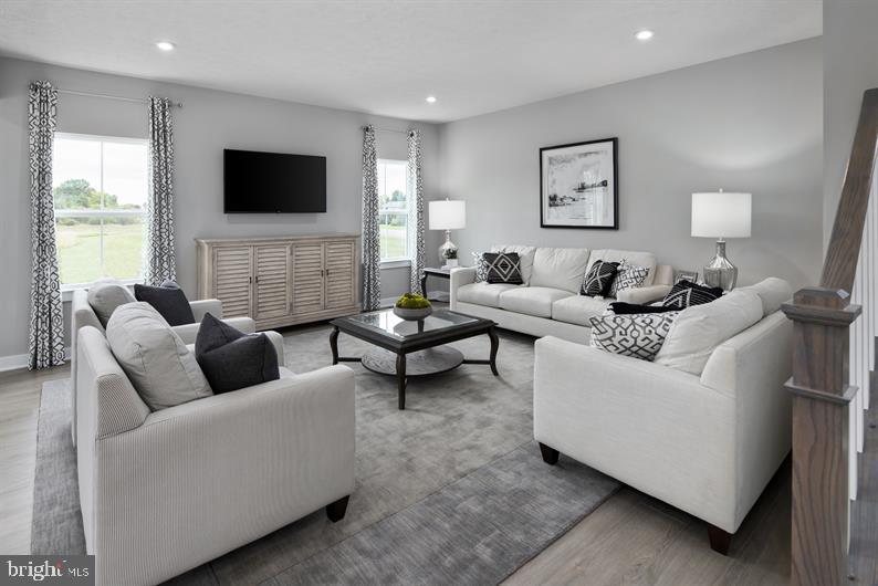 3422 Fox Pointe Lane York, PA 17404 - Photo 6 of 27 a living room with furniture and a flat screen tv