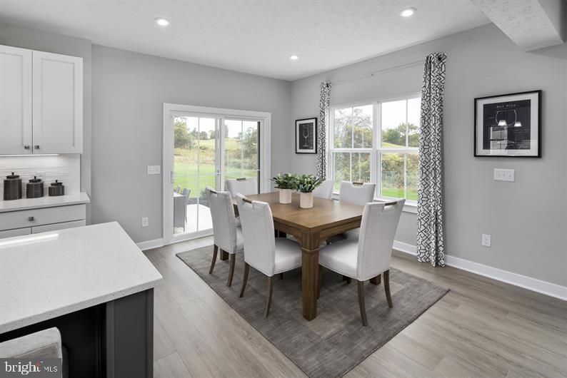 3422 Fox Pointe Lane York, PA 17404 - Photo 8 of 27 a view of a dining room with furniture window and outside view