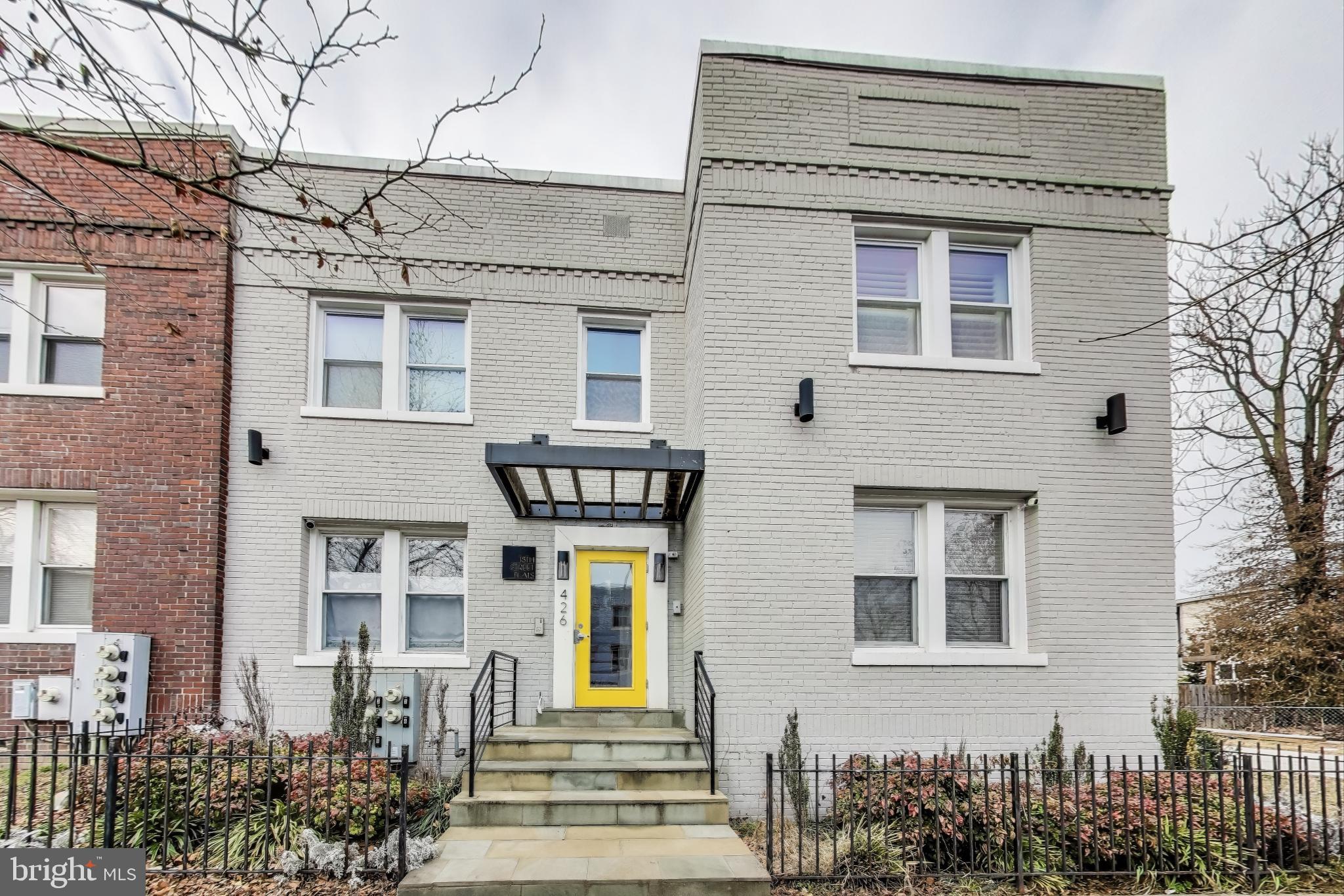 426 18th Street Northeast, Unit 2 Washington, DC 20002 - Photo 1 of 20 a front view of a house with a garden