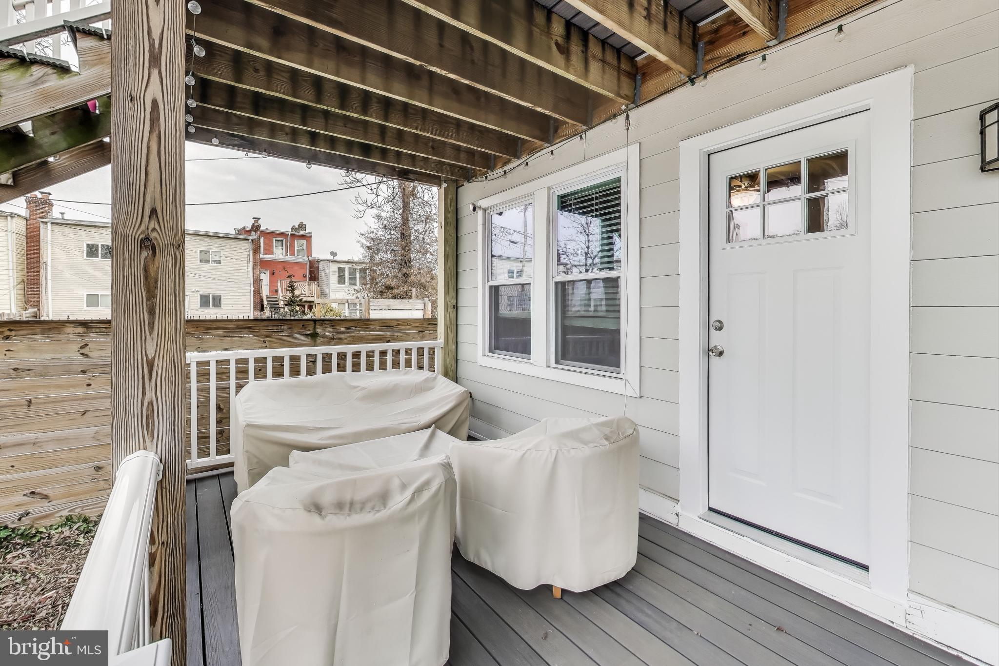426 18th Street Northeast, Unit 2 Washington, DC 20002 - Photo 16 of 20 a view of a porch with furniture and a gate