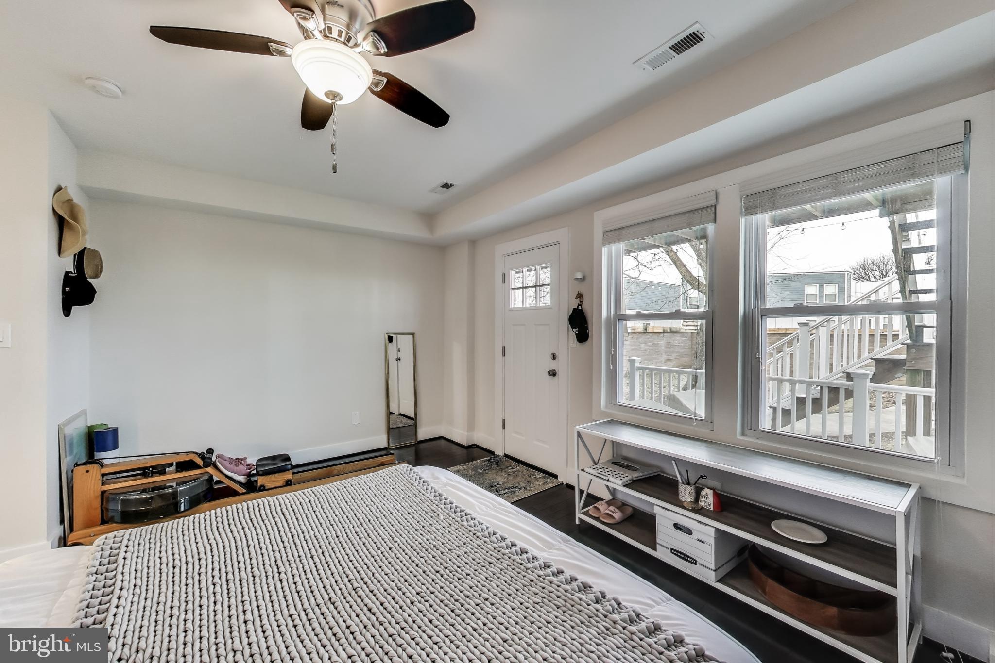426 18th Street Northeast, Unit 2 Washington, DC 20002 - Photo 8 of 20 a bedroom with furniture and windows