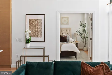 a bedroom with furniture and a window