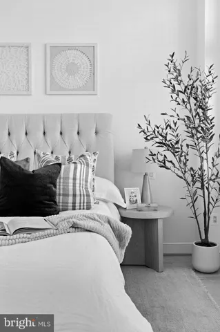 a living room with furniture and flowers