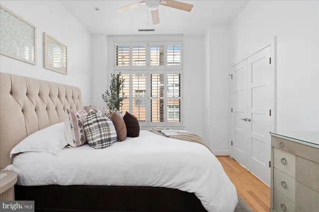 a bedroom with a bed and a window