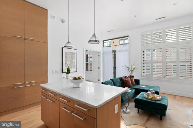 a kitchen with sink refrigerator and window