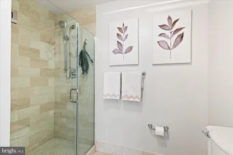 a bathroom with a shower and a sink