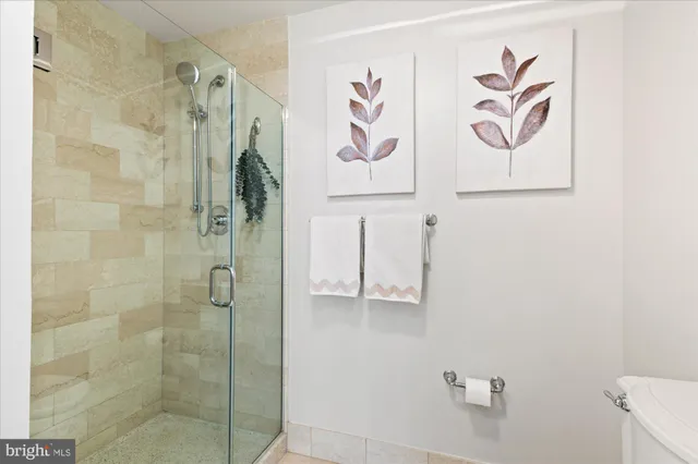a bathroom with a shower and a sink