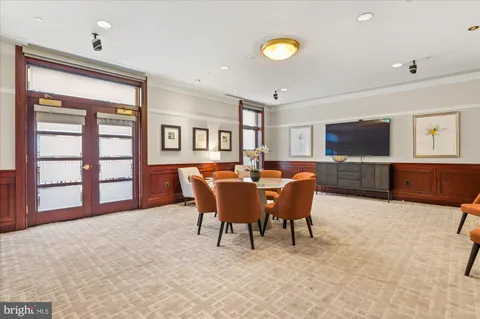 a view of a livingroom with furniture and a flat screen tv