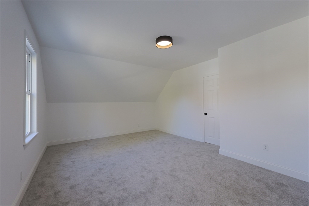 21 Irving Street Bellingham, MA 02019 - Photo 29 of 39 an empty room with a empty space and window
