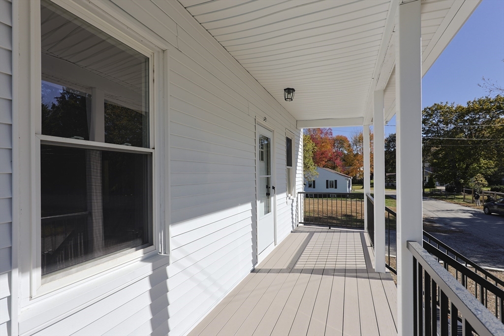 21 Irving Street Bellingham, MA 02019 - Photo 6 of 39 a view of a balcony with door