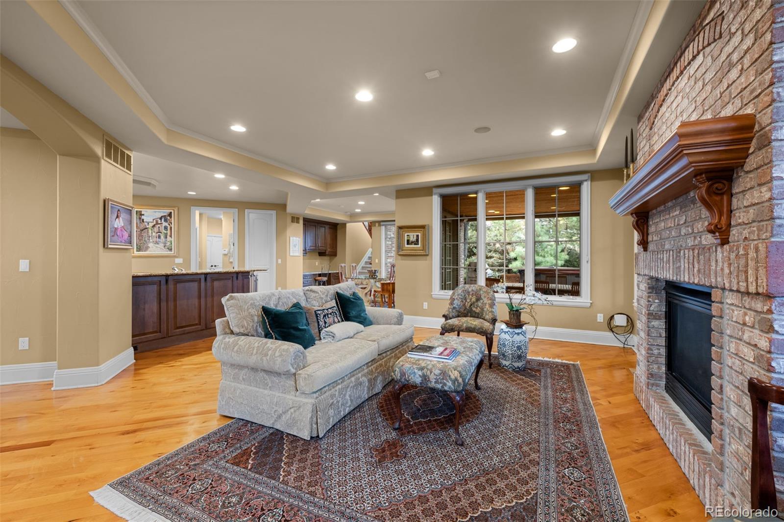 5 Redhawk Run Cherry Hills Village, CO 80113 - Photo 11 of 35 a living room with furniture and a fireplace