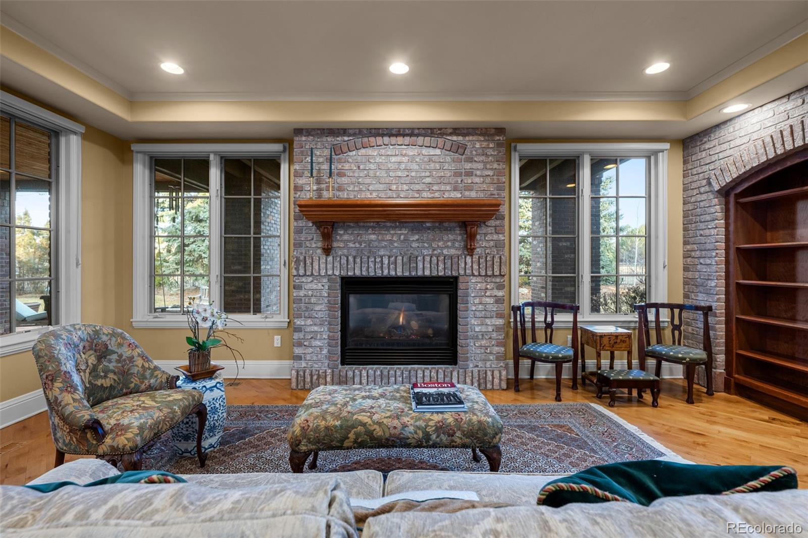 5 Redhawk Run Cherry Hills Village, CO 80113 - Photo 12 of 35 a living room with furniture and a fireplace