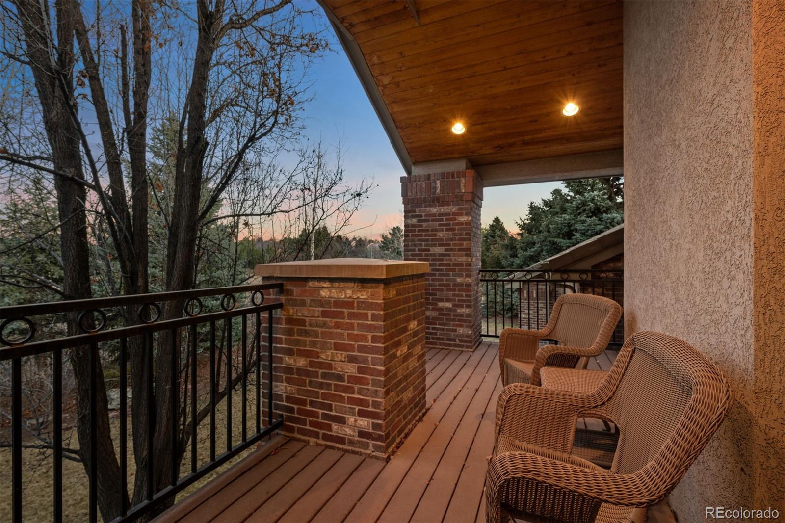 5 Redhawk Run Cherry Hills Village, CO 80113 - Photo 18 of 35 a view of balcony with wooden floor and outdoor seating