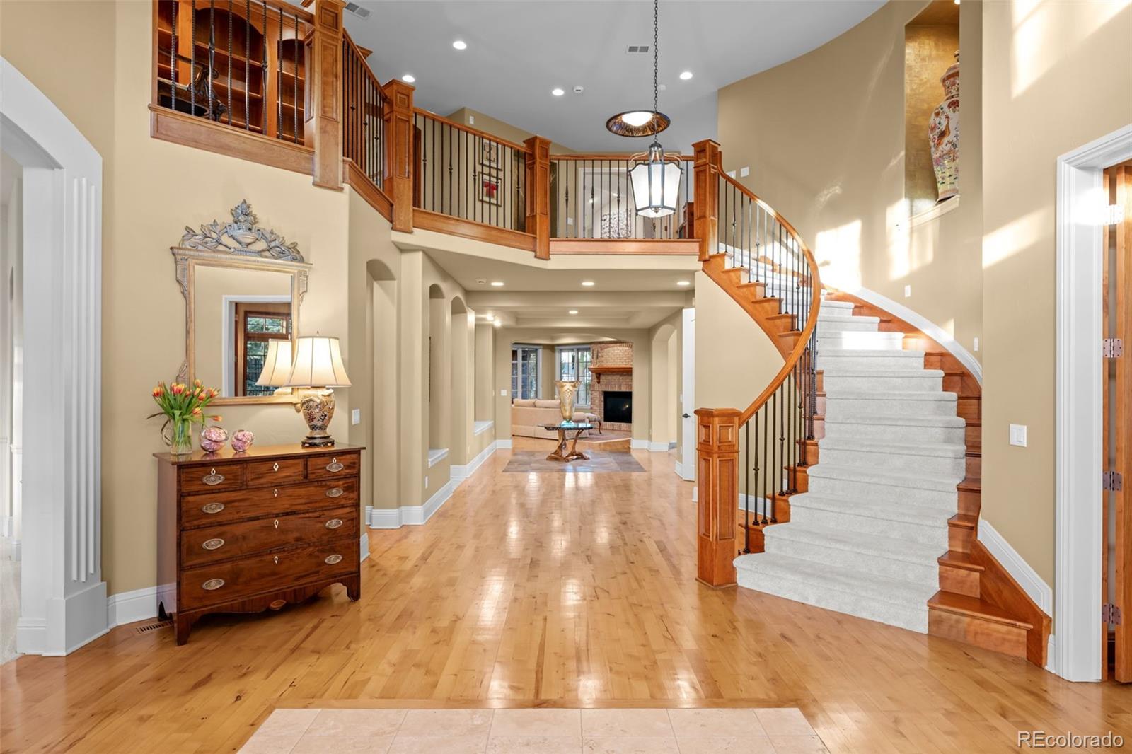 5 Redhawk Run Cherry Hills Village, CO 80113 - Photo 2 of 35 a view of entryway and hall with wooden floor