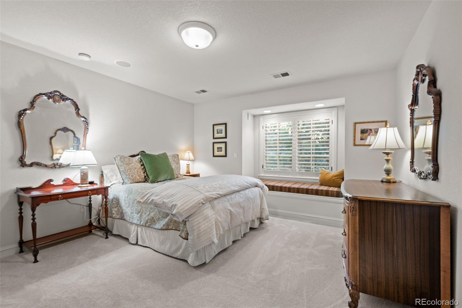 5 Redhawk Run Cherry Hills Village, CO 80113 - Photo 22 of 35 a spacious bedroom with a bed and window