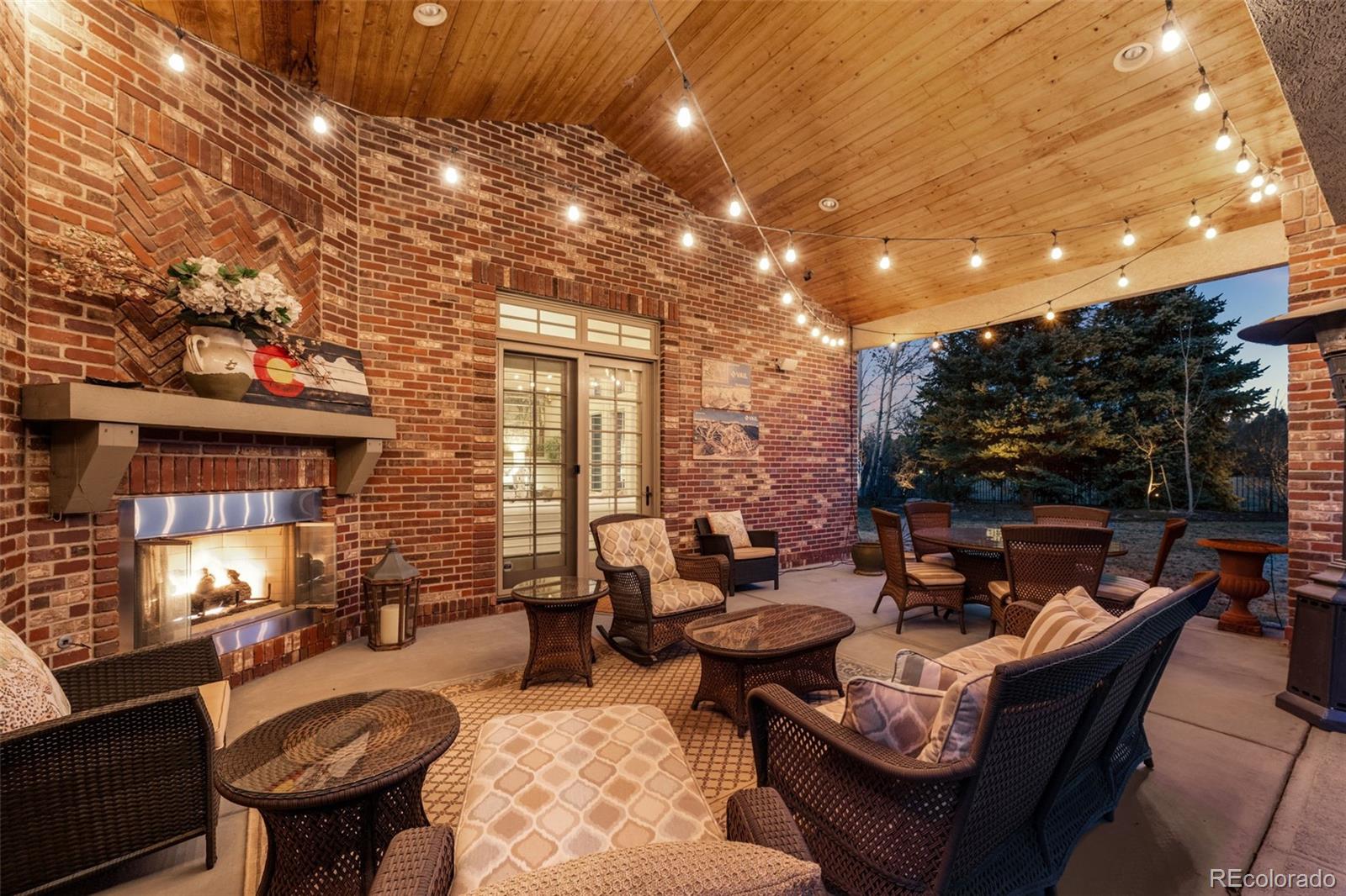 5 Redhawk Run Cherry Hills Village, CO 80113 - Photo 31 of 35 a outdoor space with furniture and fireplace
