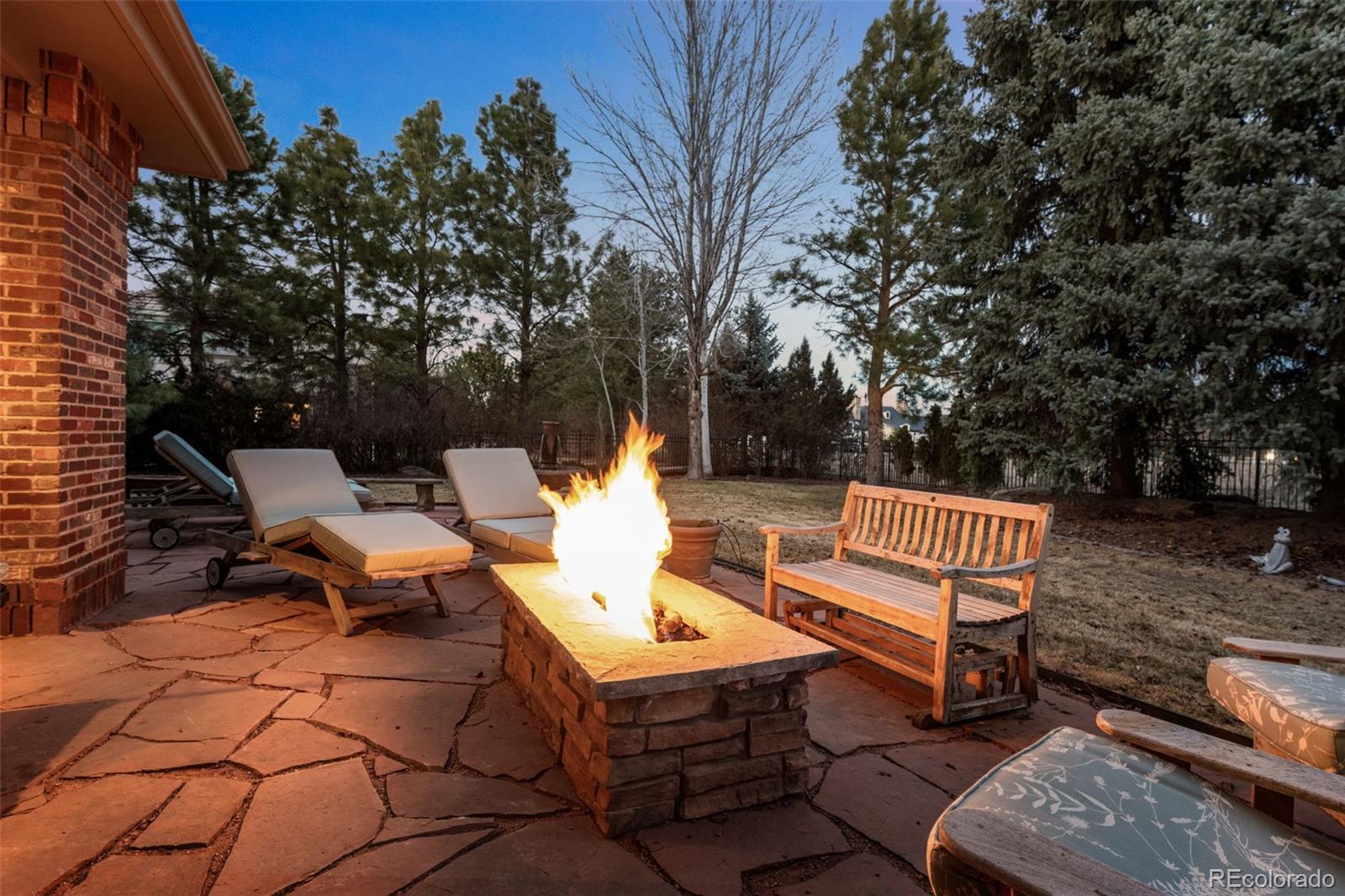 5 Redhawk Run Cherry Hills Village, CO 80113 - Photo 32 of 35 a view of a bench in the backyard