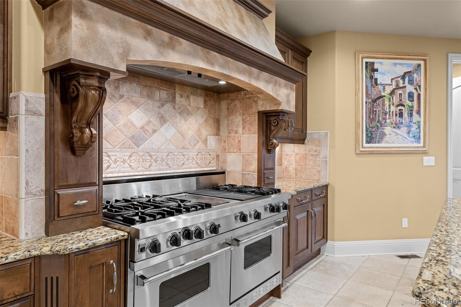 5 Redhawk Run Cherry Hills Village, CO 80113 - Photo 7 of 35 a white stove top oven sitting inside of a kitchen