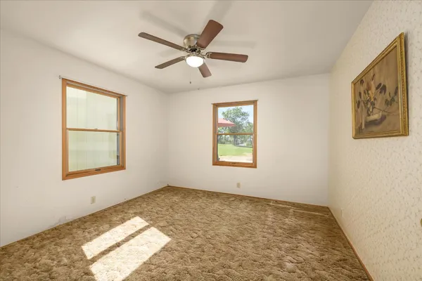 a bathroom with a shower sink and mirror