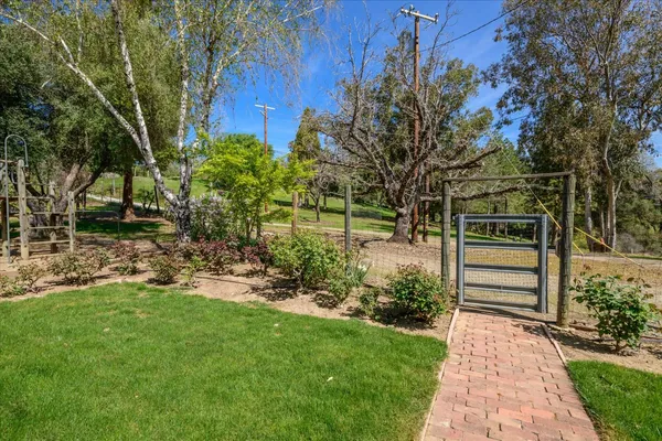 a view of backyard with cabin