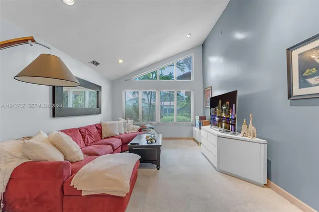 a spacious bedroom with a bed and a couch