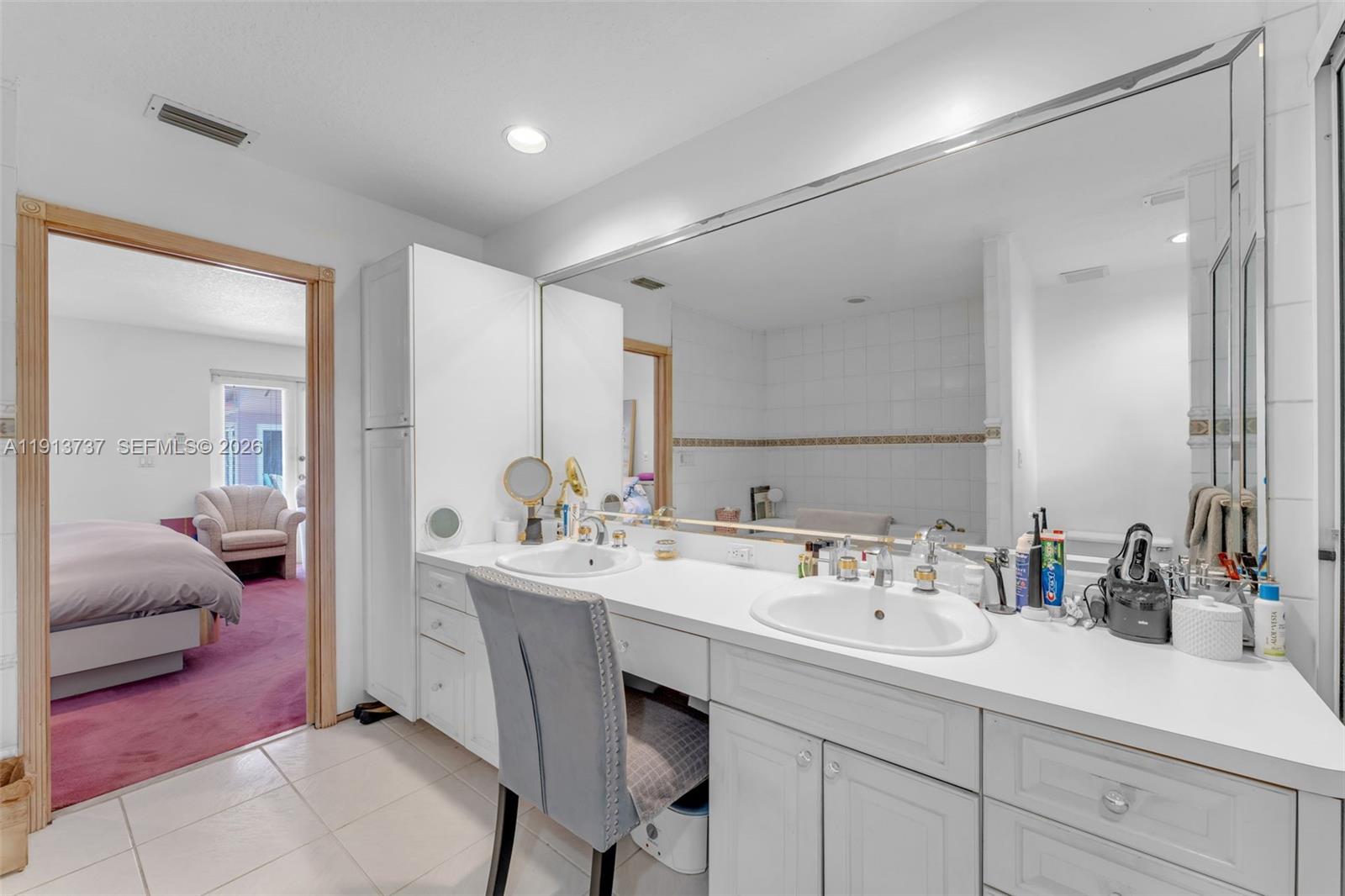 10220 Southwest 140th Street Miami, FL 33176 - Photo 25 of 53 a en suite bathroom with a sink double vanity and a mirror
