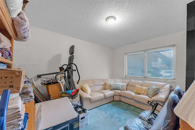 an aerial view of a house with a garden