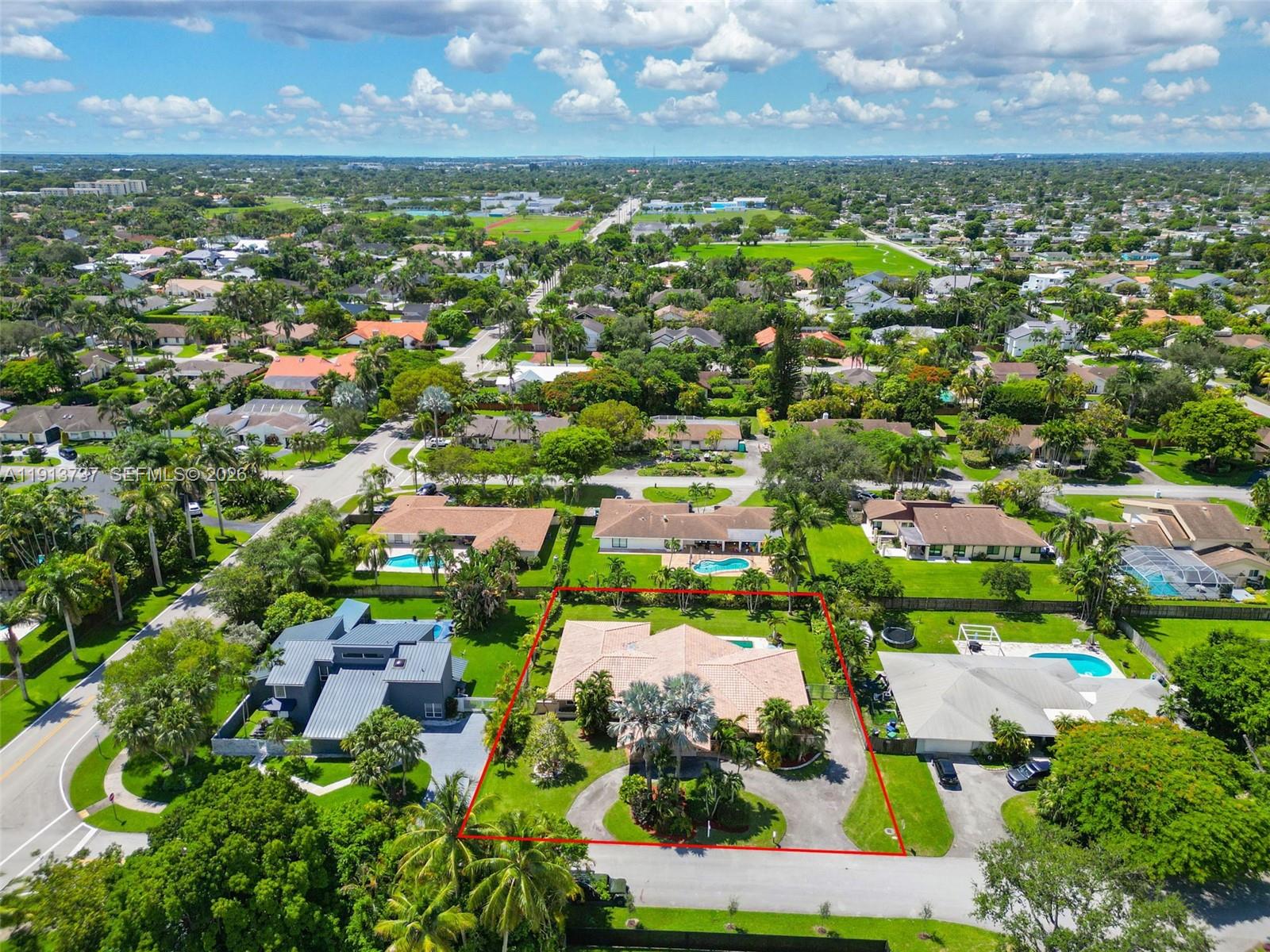 10220 Southwest 140th Street Miami, FL 33176 - Photo 42 of 53 an aerial view of residential houses with outdoor space and trees