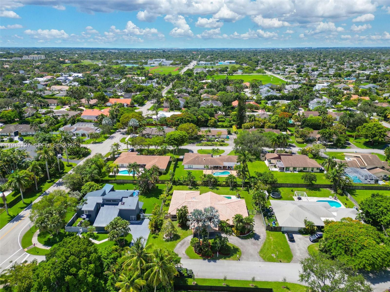 10220 Southwest 140th Street Miami, FL 33176 - Photo 43 of 53 an aerial view of residential houses with outdoor space and trees