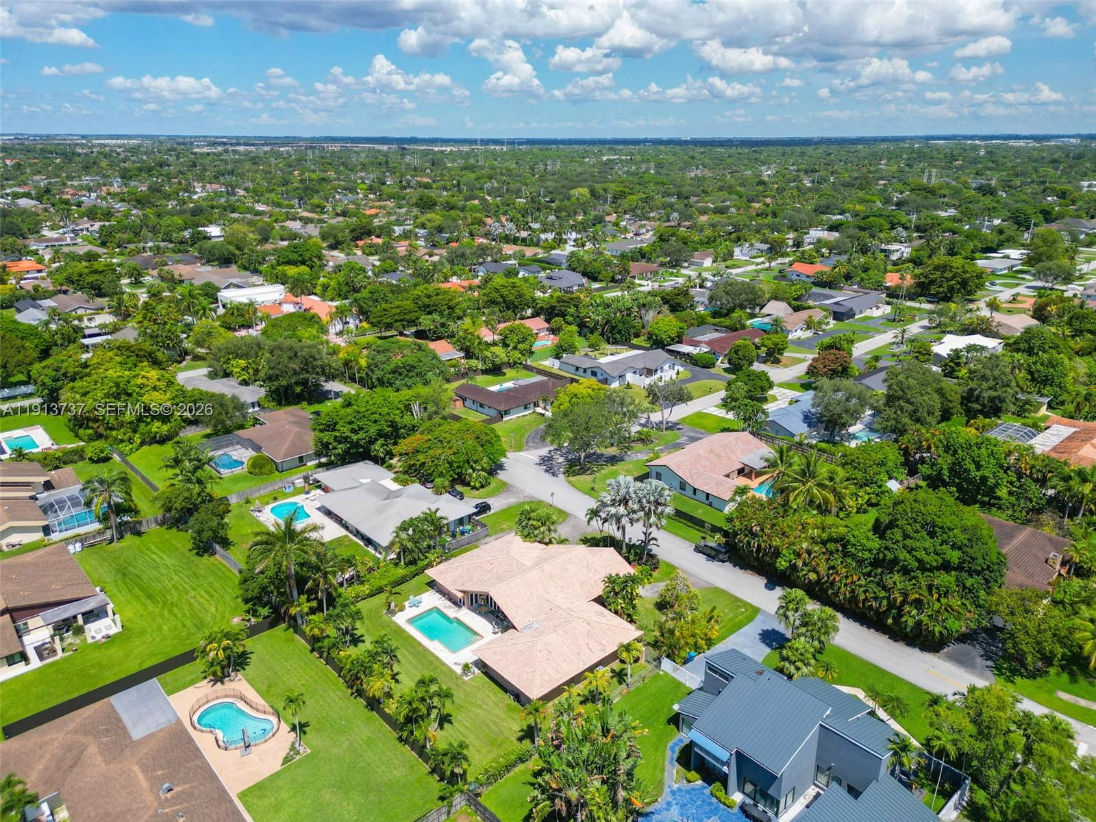 10220 Southwest 140th Street Miami, FL 33176 - Photo 47 of 53 an aerial view of residential houses with outdoor space and trees