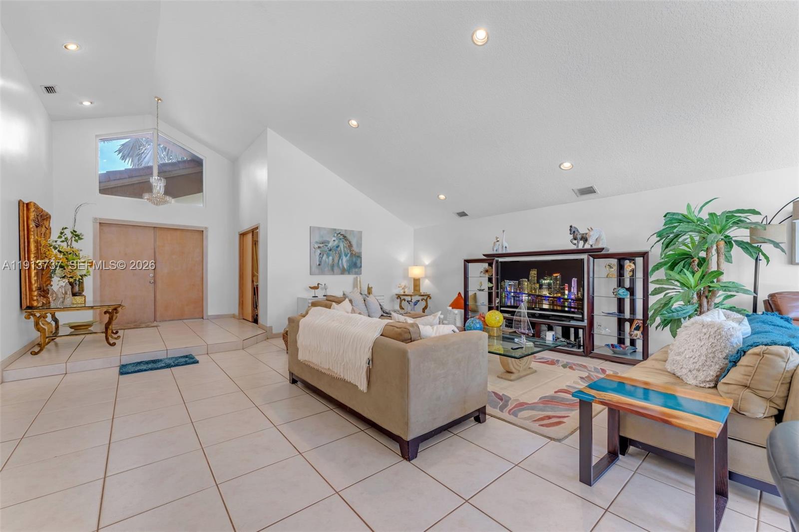 10220 Southwest 140th Street Miami, FL 33176 - Photo 9 of 53 a living room with furniture and a potted plant