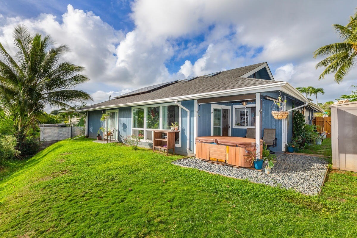 4845 Ohu Road Kapaa, HI 96746 - Photo 12 of 13 a view of a house with a yard and sitting area