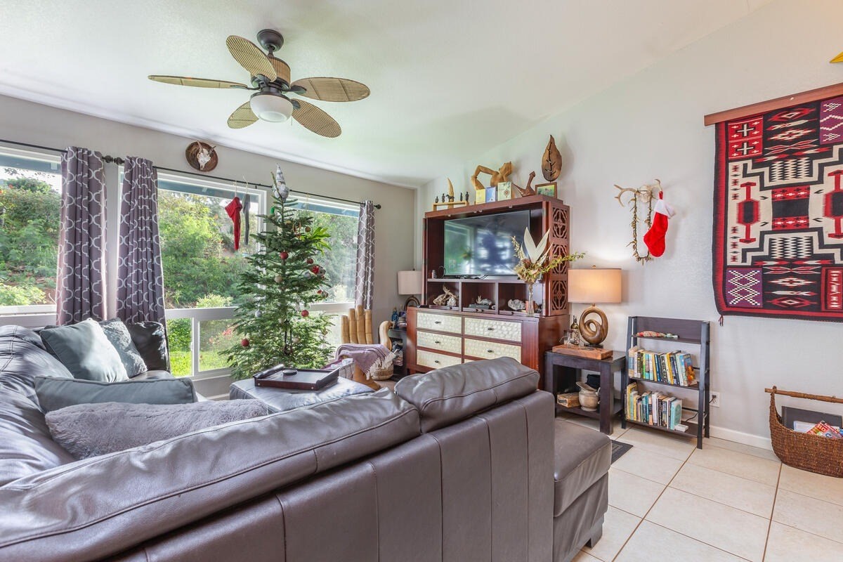 4845 Ohu Road Kapaa, HI 96746 - Photo 6 of 13 a living room with furniture and a large window