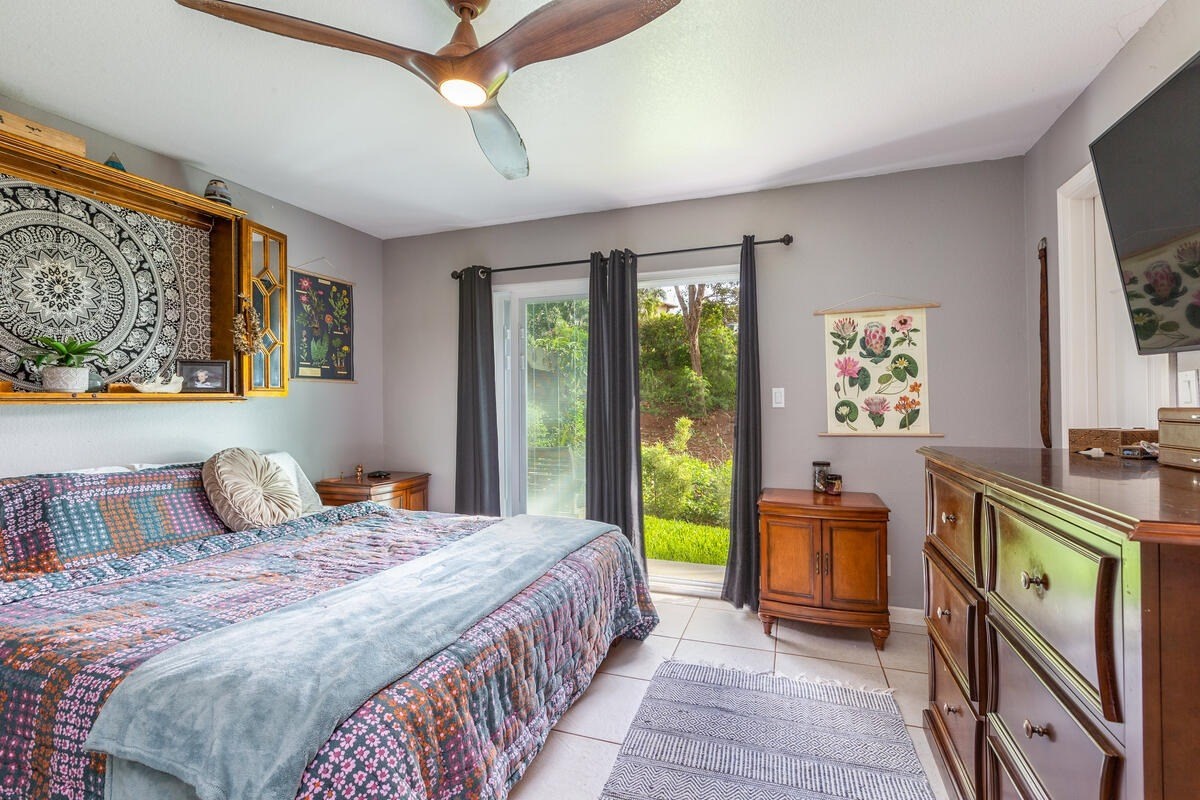 4845 Ohu Road Kapaa, HI 96746 - Photo 7 of 13 a bedroom with a bed a dresser next to a window