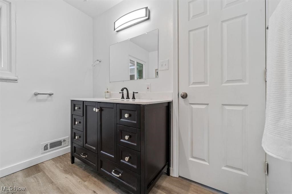 25096 Highland Road Cleveland, OH 44143 - Photo 22 of 34 Bathroom featuring vanity and hardwood / wood-style flooring