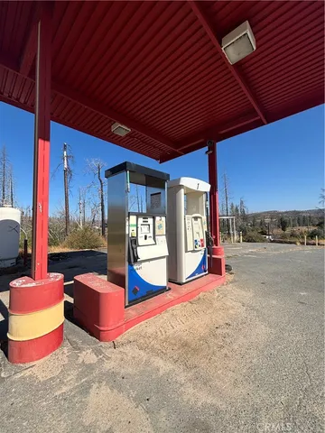 a view of a porch with furniture and a yard