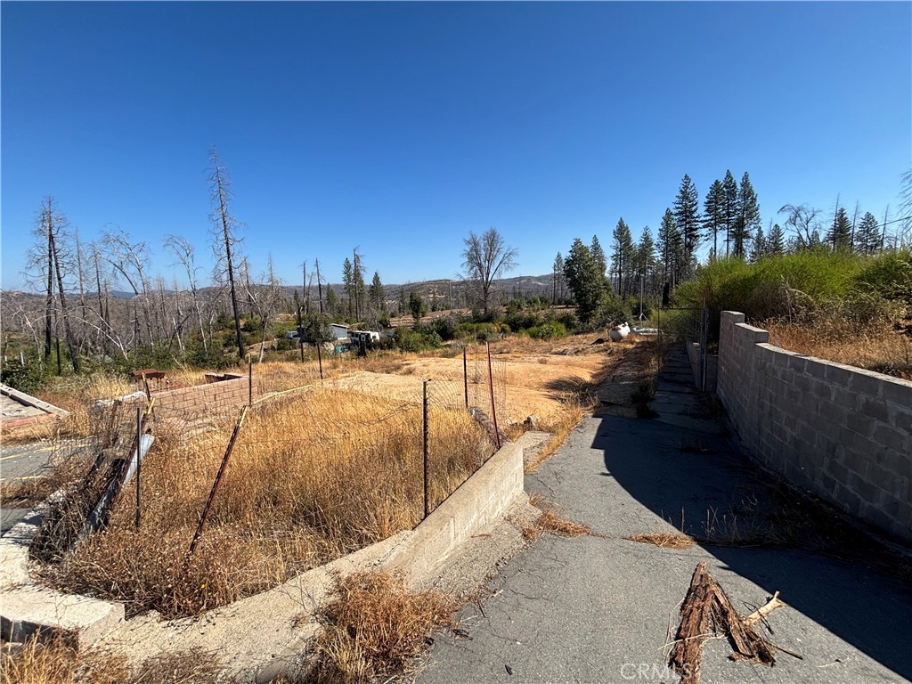 1049 Bald Rock Road Berry Creek, CA 95916 - Photo 11 of 11 a view of a swimming pool with a patio