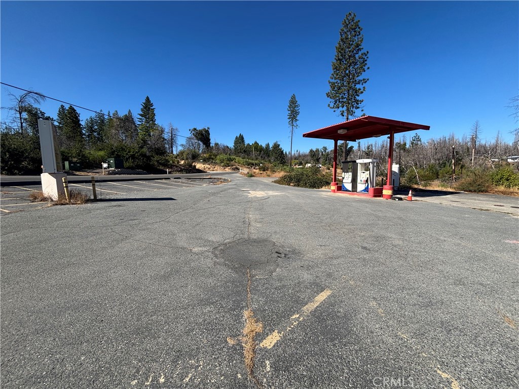 1049 Bald Rock Road Berry Creek, CA 95916 - Photo 2 of 11 a view of patio with a fire pit and trees