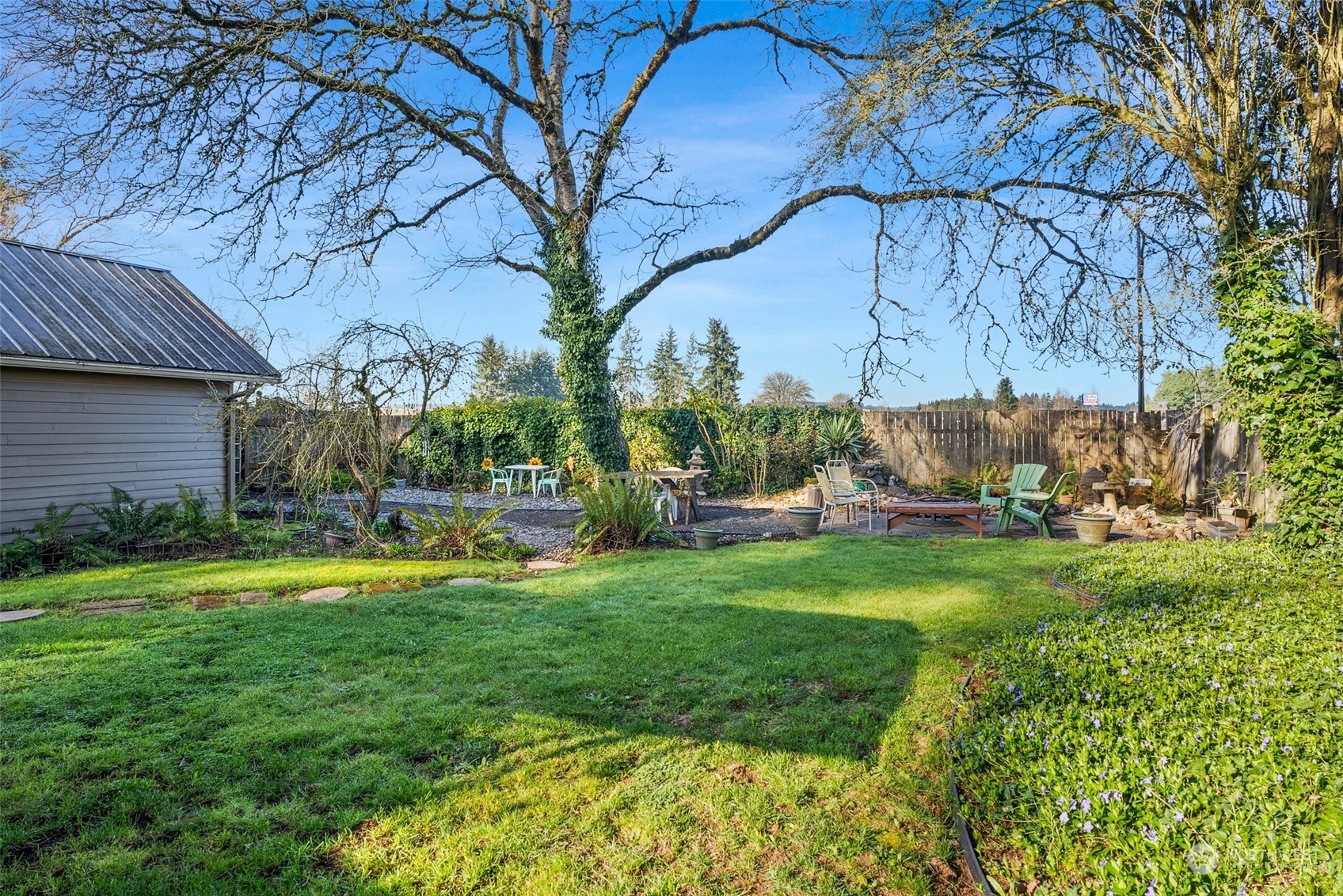 809 Long Road Centralia, WA 98531 - Photo 27 of 37 a backyard of a house with table and chairs