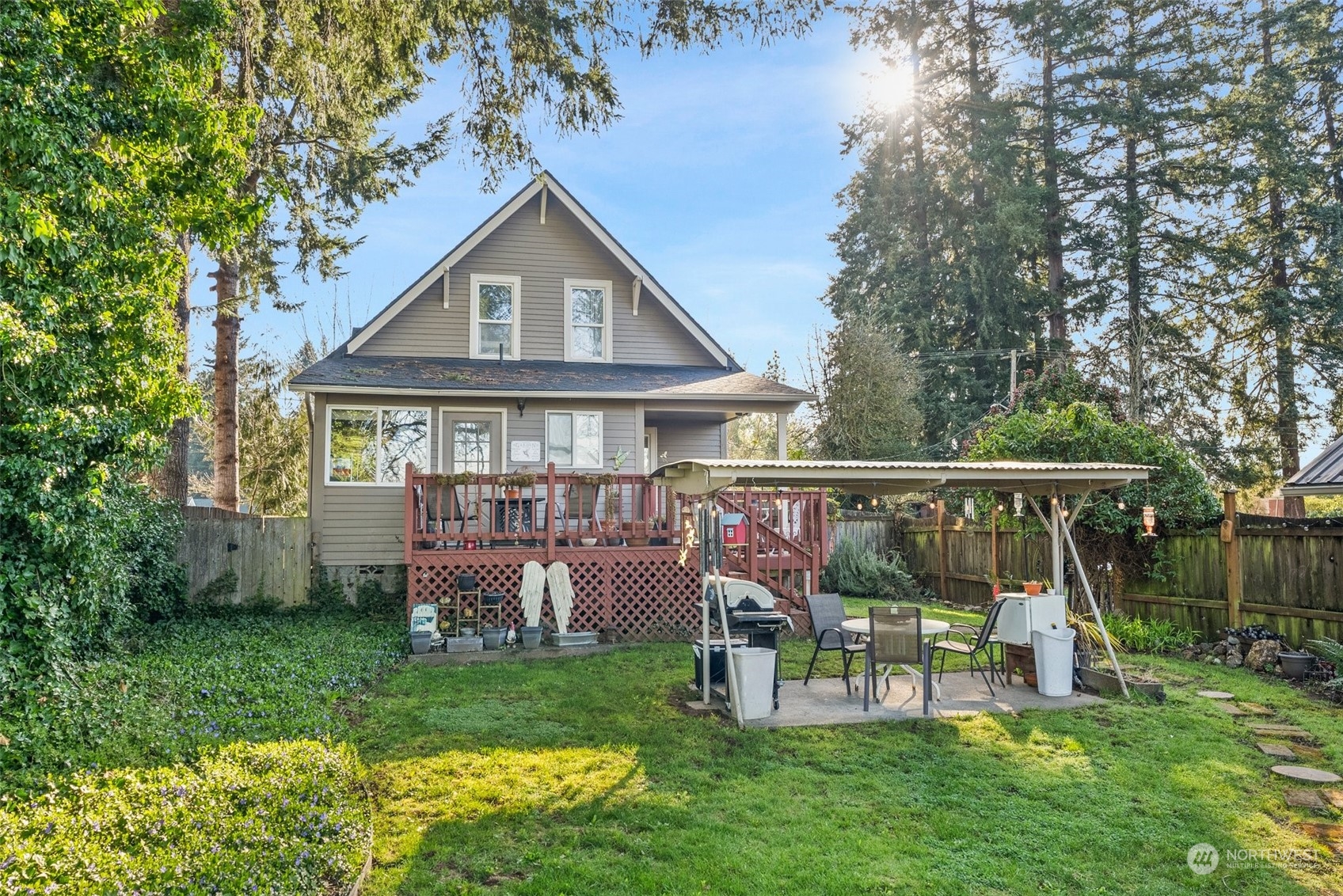 809 Long Road Centralia, WA 98531 - Photo 30 of 37 a view of a deck with a yard potted plants and a large tree