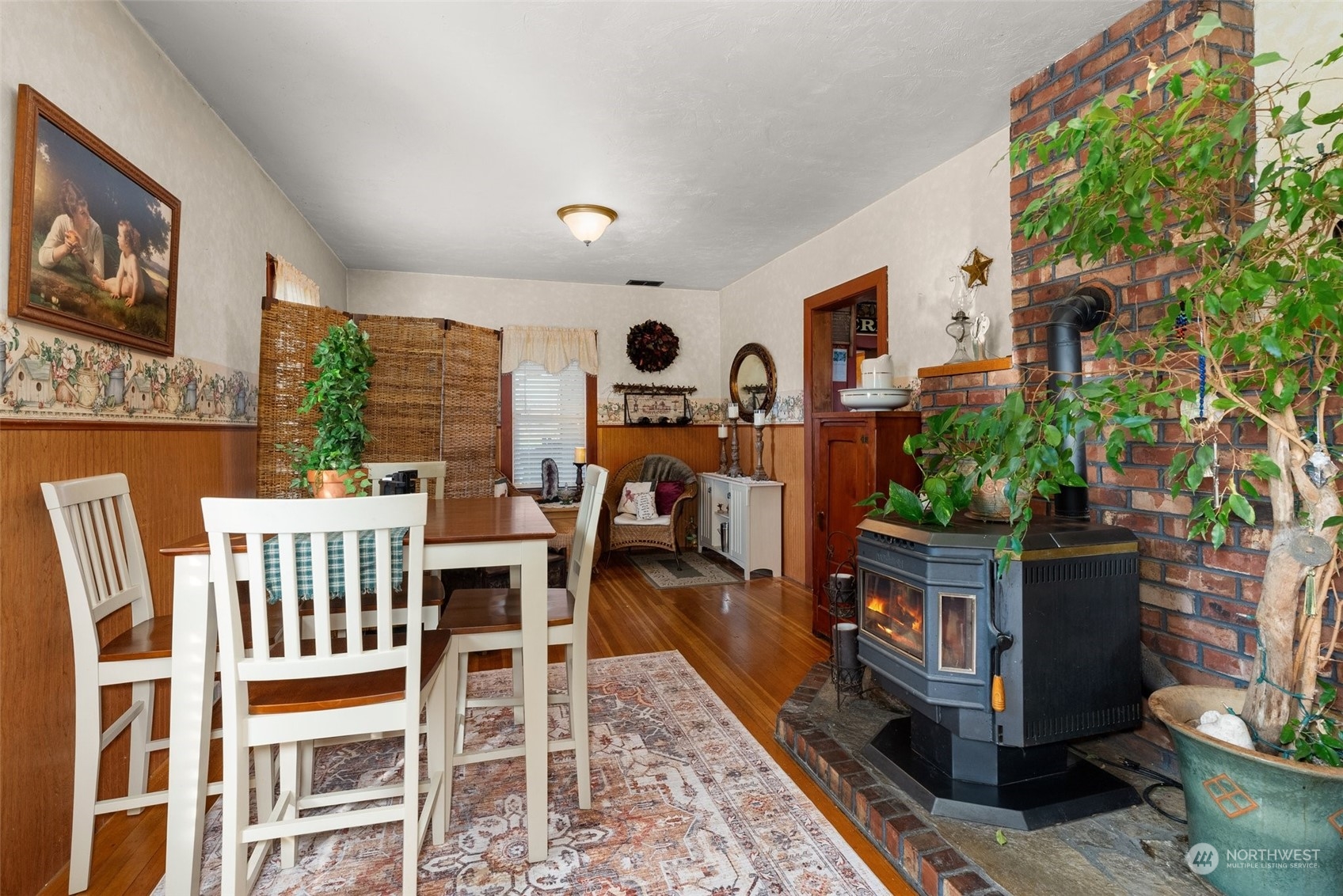 809 Long Road Centralia, WA 98531 - Photo 5 of 37 a living room with furniture a rug and a fireplace