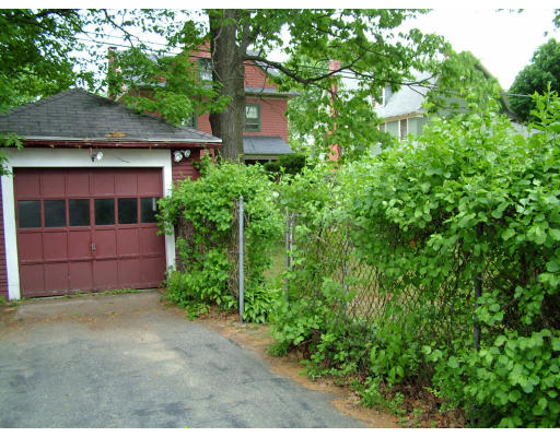 66 Garfield Street Springfield, MA 01108 - Photo 11 of 12 front view of a house with a yard