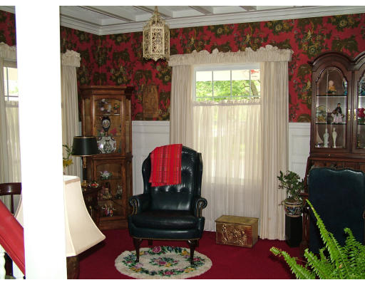 66 Garfield Street Springfield, MA 01108 - Photo 3 of 12 a living room with furniture a flat screen tv and a window