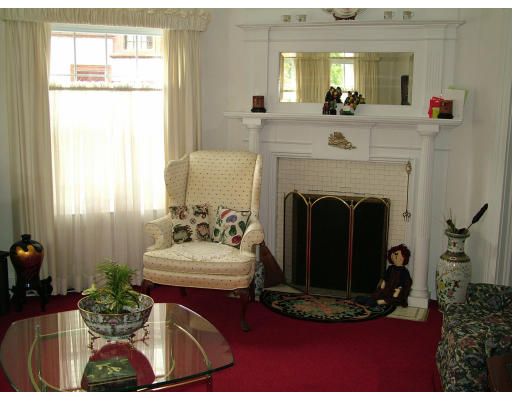 66 Garfield Street Springfield, MA 01108 - Photo 4 of 12 a living room with furniture a fireplace and a large mirror